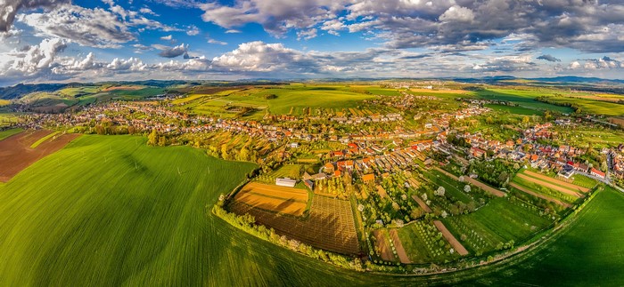 Aerial view of Zlechov, Czech Republic with fields and clouds