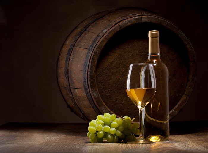 White Wine Bottle, Glass, Grapes, and Barrel