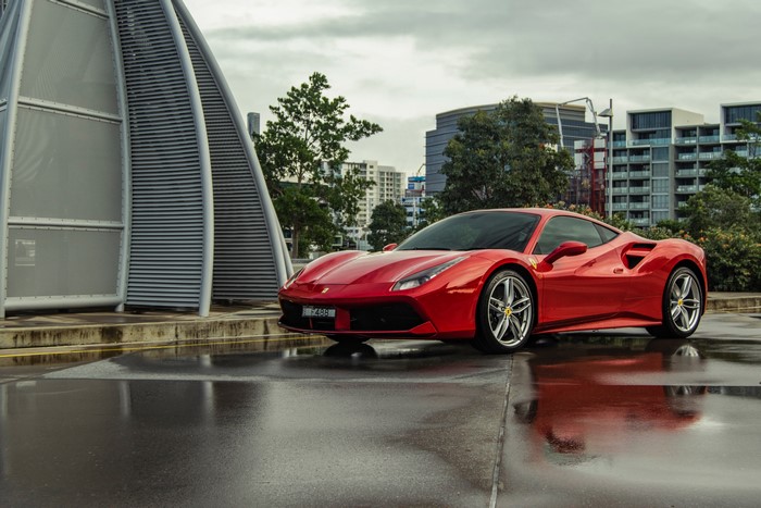 Red Ferrari 488 GTB on Wet Pavement