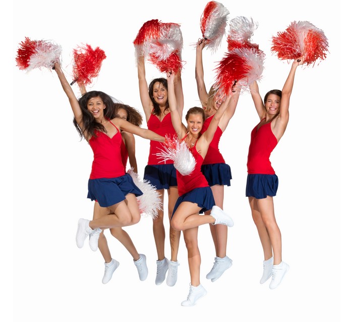 Cheerleaders jumping with pom-poms