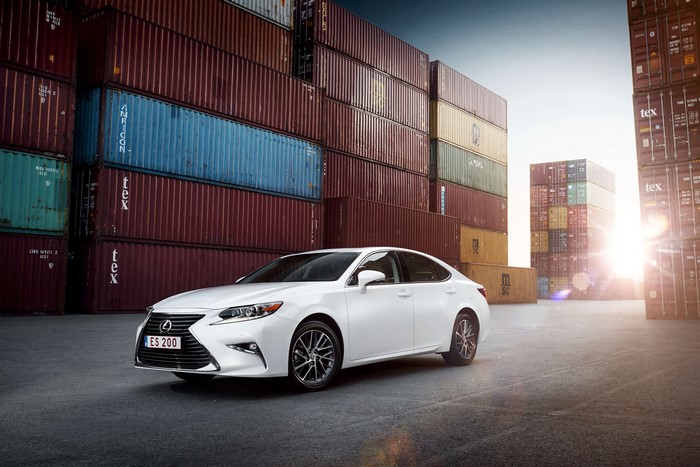White Lexus ES 200 in a shipping container yard