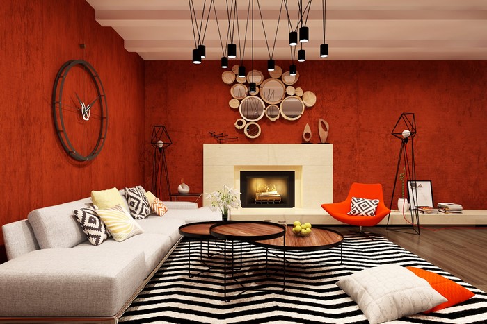 Modern living room with orange walls and fireplace