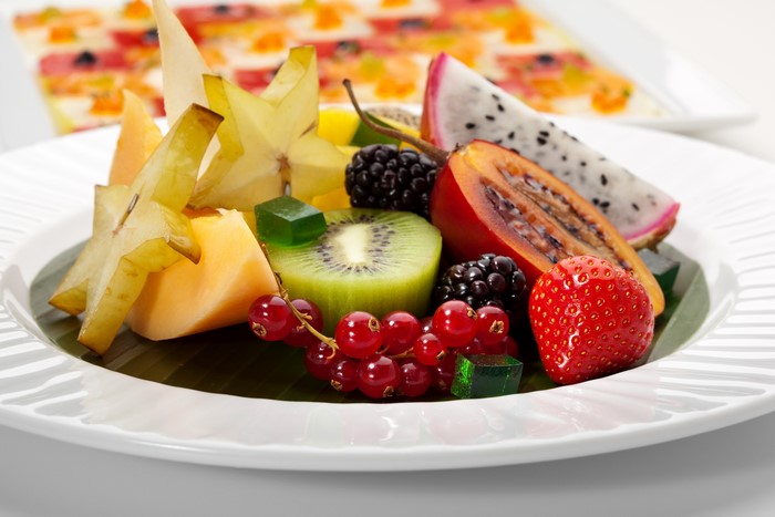 Fruit platter with star fruit, kiwi, berries, and dragon fruit