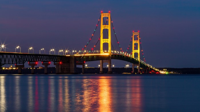 Mackinac Bridge at night with colorful lights