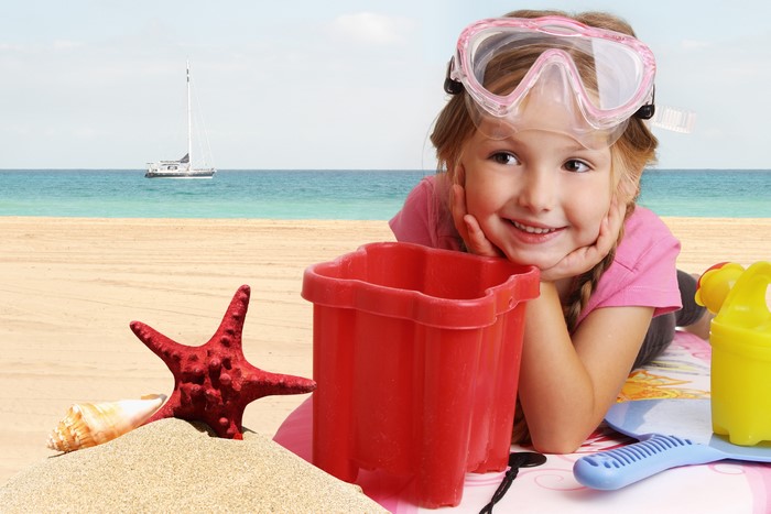 Girl with Goggles and Beach Toys