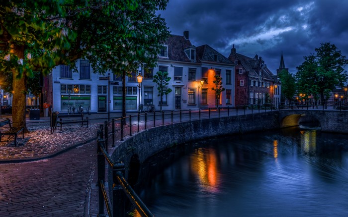 Street lights on a canal in Amersfoort, Netherlands at night
