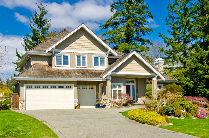 Luxury house with garage and manicured garden