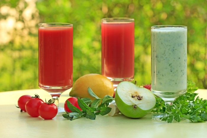 Three glasses of juice with fruits and vegetables