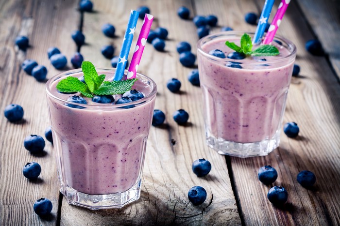 Two Blueberry Smoothies with Mint and Straws
