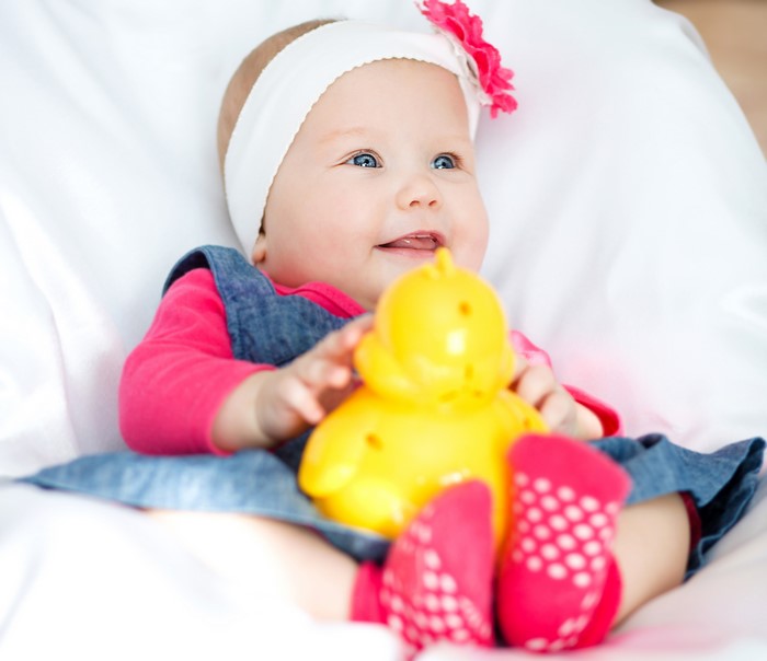 Baby girl with toy