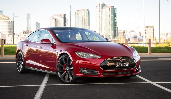 Red Tesla Model S P85D parked in city