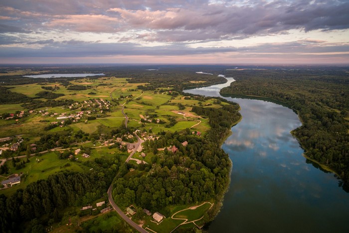 Aerial view of Dubingiai, Lithuania with river and village