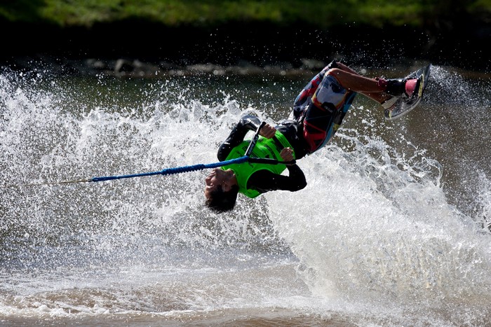 Man performing a flip on a wakeboard