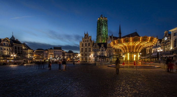 Carousel and buildings in Mechelen, Belgium at night