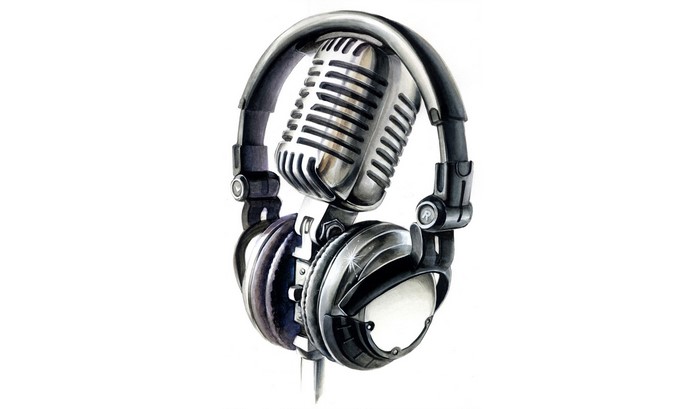 Vintage microphone and headphones on white background