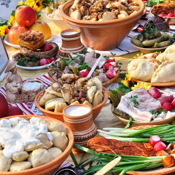 Traditional Ukrainian Food Spread with Pierogi and Sausage