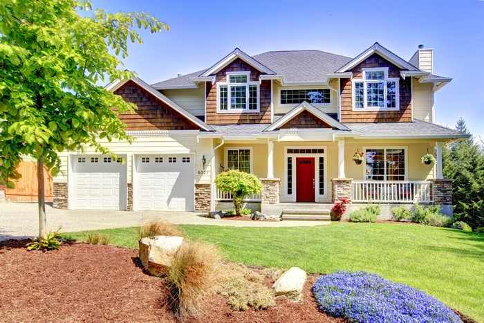 Yellow House with Red Door and Two Garages