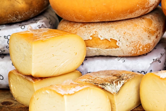 Various cheeses on display