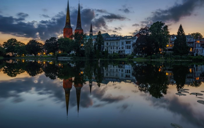 Twin Spires Reflected in Water at Dusk