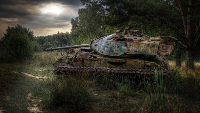 Abandoned M41 Walker Bulldog tank in a forest