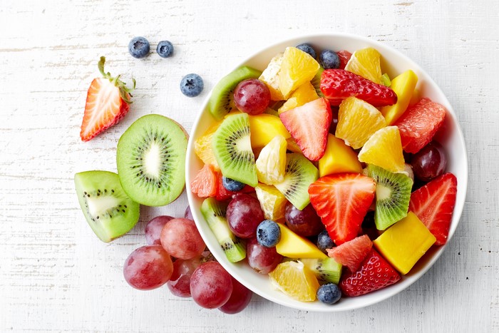 Fruit salad with strawberries, kiwi, grapes, and blueberries