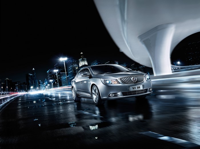 Buick LaCrosse driving at night in a city