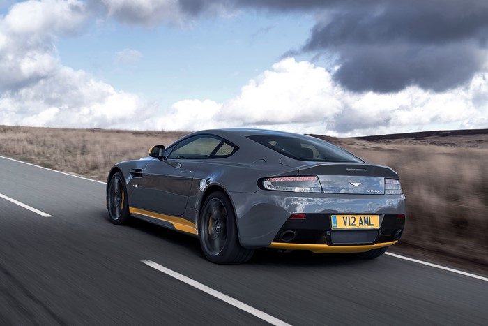 Aston Martin V12 Vantage S driving on a road