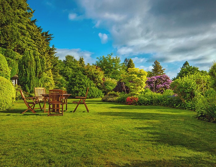 Garden with wooden table and chairs