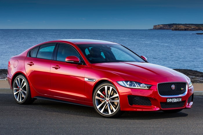 Red 2015 Jaguar XE S by the Sea