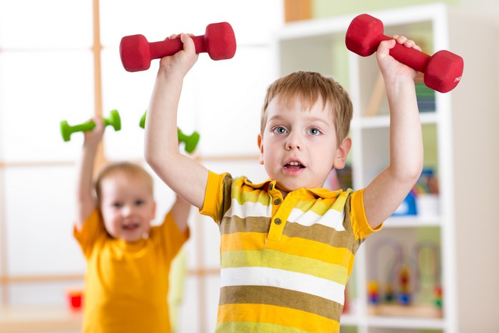 Boys lifting dumbbells