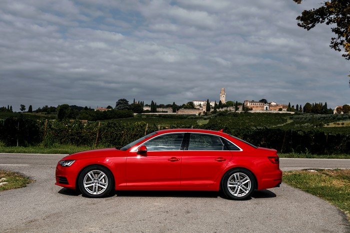 Red Audi A4 2.0 TDI ultra parked on road