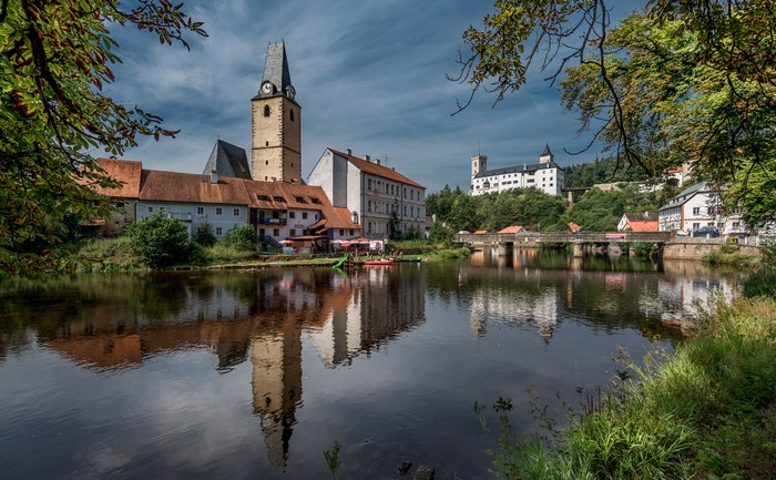 Town with a Church Tower and Castle by a River