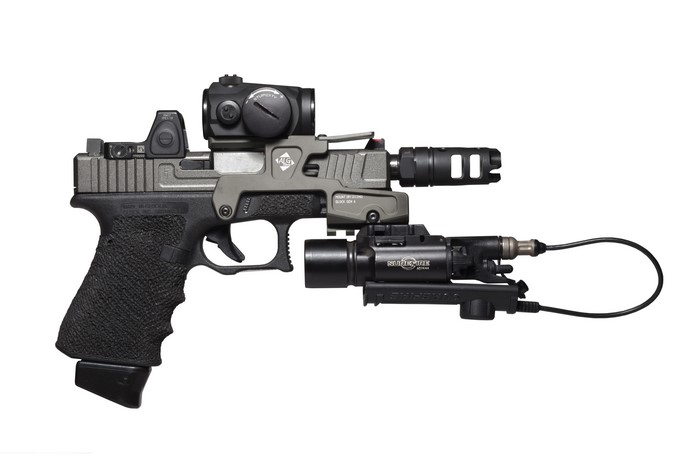 Glock 17 pistol with red dot sights and SureFire light