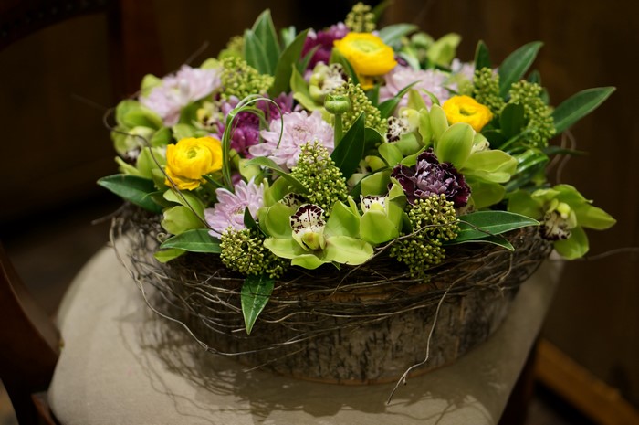 Orchid and Ranunculus Flower Arrangement in Rustic Basket