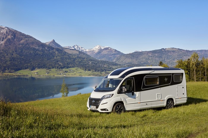2017 Niesmann Bischoff Smove motorhome by a lake and mountains