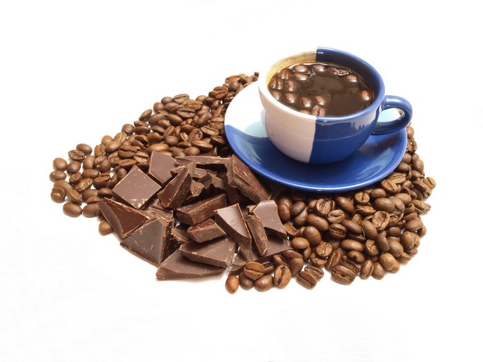 Coffee cup with chocolate and coffee beans