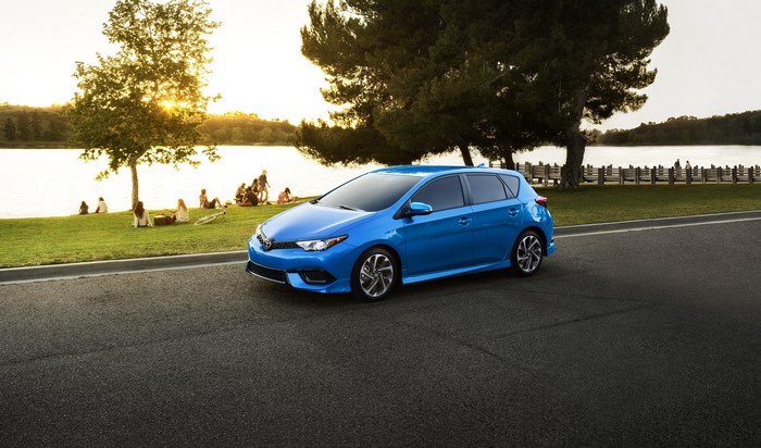 Blue 2017 Toyota Corolla iM parked by a lake