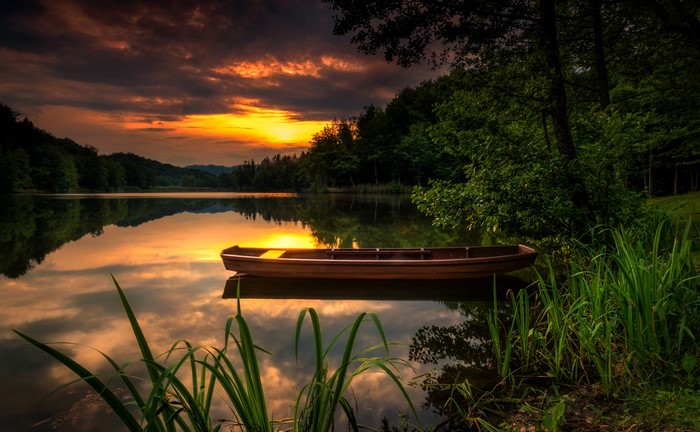Boat on a lake at sunset