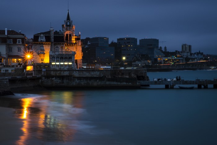 Cascais, Portugal at Night with Illuminated Buildings and Ocean