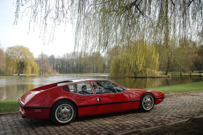 Red 1970 NART Zagato car by a lake