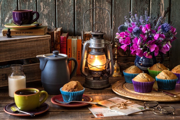 Still-life with coffee, muffins, and flowers
