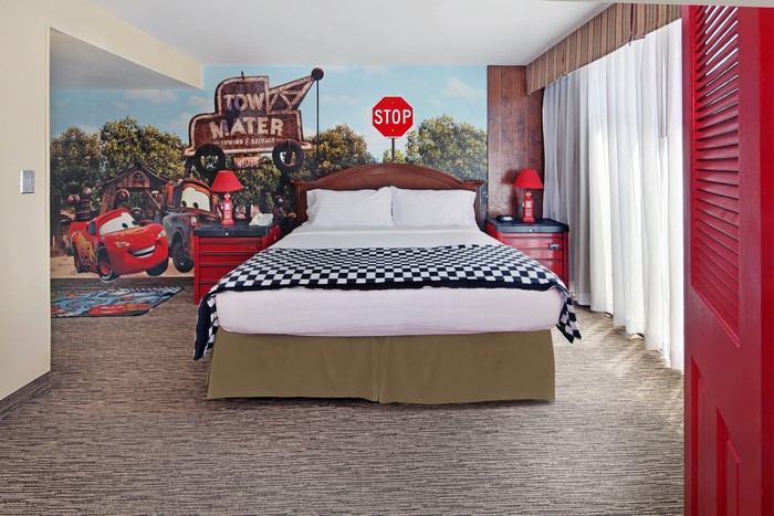 Cars themed bedroom with bed and mural