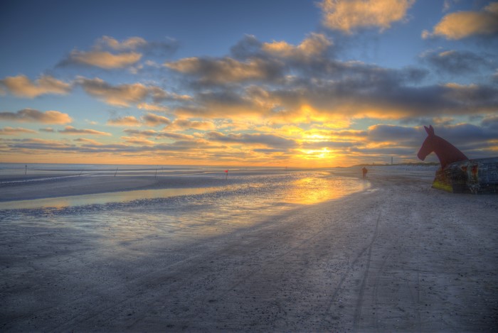 Sunset over Jylland coast with horse sculpture, Denmark
