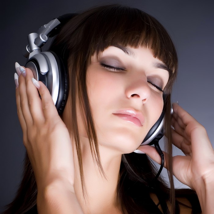 Woman with headphones listening to music