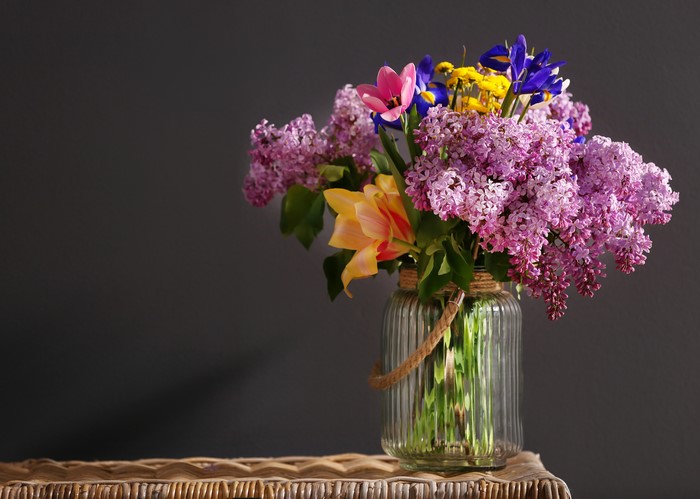 Bouquet of Lilacs, Tulips, and Irises in a Glass Jar