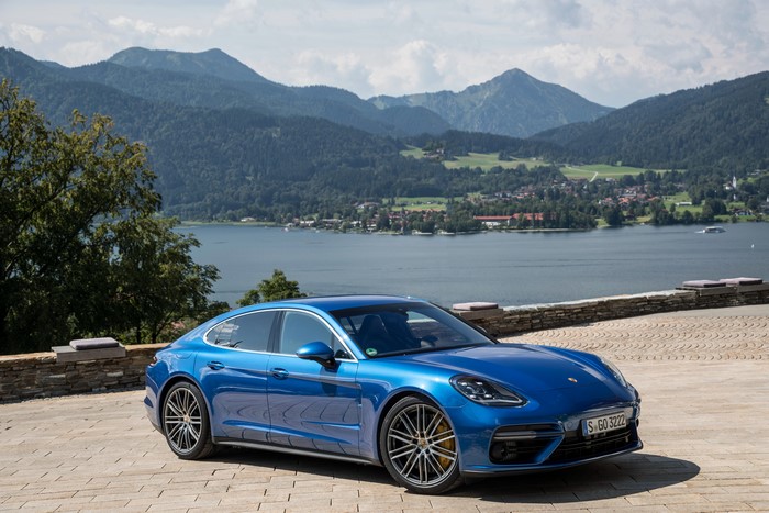 Blue 2016 Porsche Panamera Turbo by a lake