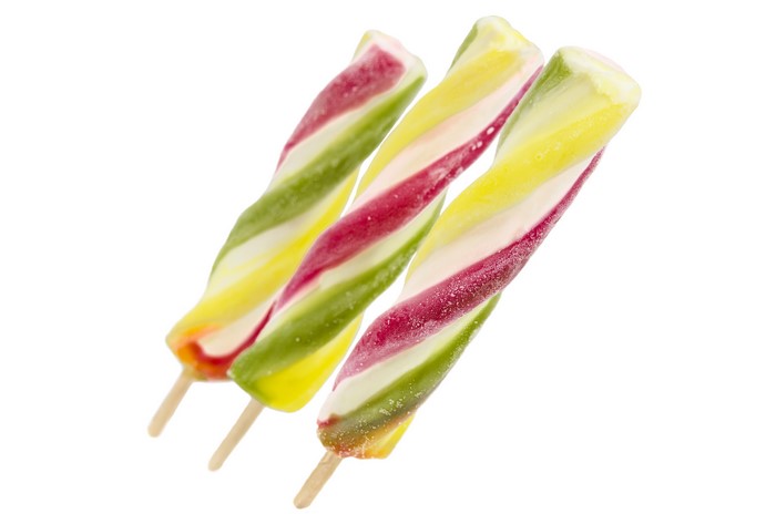Three colorful twisted ice pops on white background