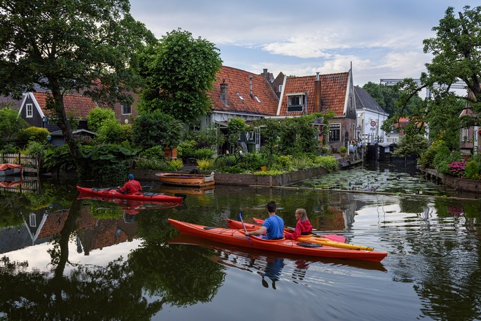 Kayakers on a canal in Edam, Netherlands