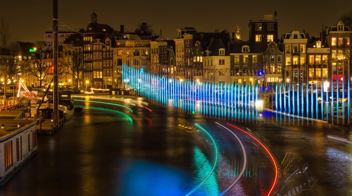 Amsterdam canal at night with light installation