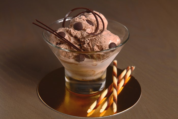 Chocolate ice cream sundae with chocolate chips and wafers